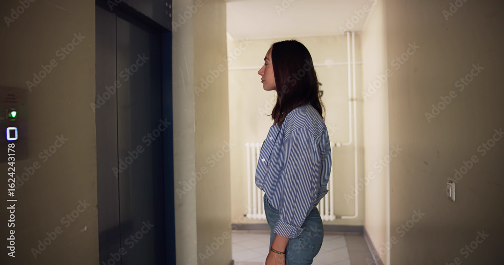 Female Construction Worker Using Elevator Female Construction Worker Using Elevator