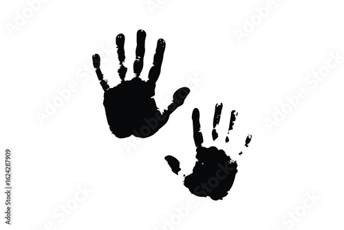 Two black handprint silhouettes with a rough texture isolated on a clean white background representing childhood memories and family connections isolated on white background