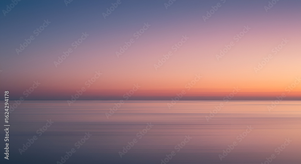 Fototapeta premium Blurry sunset over a calm sea