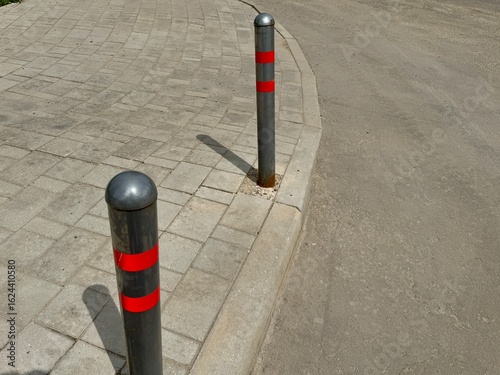 Fototapeta Naklejka Na Ścianę i Meble -  parking poles are gray-red on a warm summer day. High quality photo