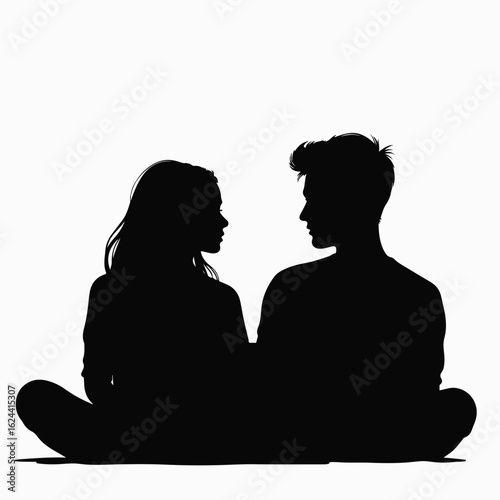 Teen couple watching movie on laptop together in black silhouette, with focused expressions. This teen couple enjoying digital entertainment are silhouetted against a clean backdrop,