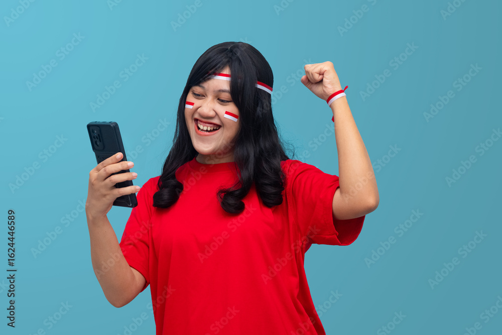Woman holding phone and flag, surprised expression. Great for online news, announcements, or Indonesia Independence Day concep Woman holding phone and flag, surprised expression. Great for online news, announcements, or Indonesia Independence Day concep