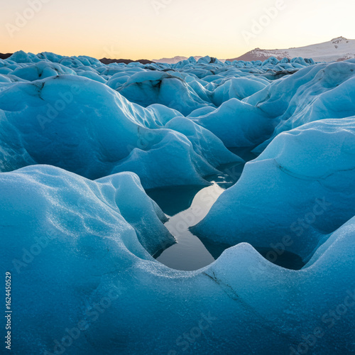 Azure Ice Canyons: Sunlit Glacial Meltwater Creates Timeless Beauty.