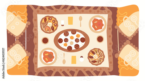 Overhead view of a table set with various dishes and drinks on a decorative tablecloth design image