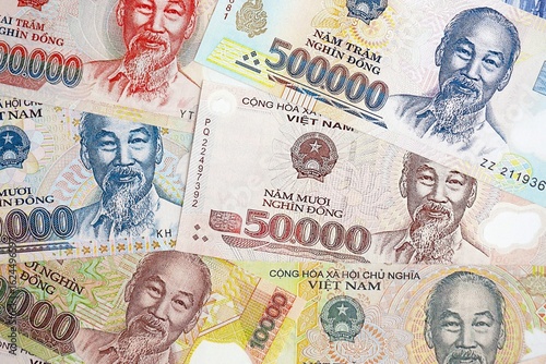 Wallpaper Mural Vietnamese dong currency money bills. The current banknotes lies on table in big amount Torontodigital.ca