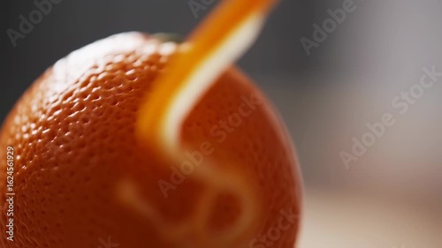 Closeup of Orange Fruit with Water Droplets and Bright Surface Details