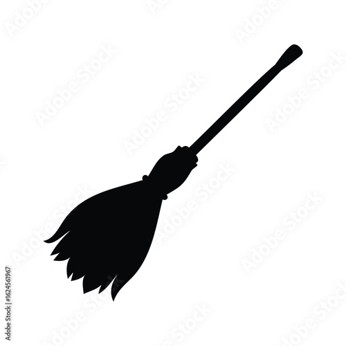 A traditional witch's broom in silhouette set against a plain white backdrop