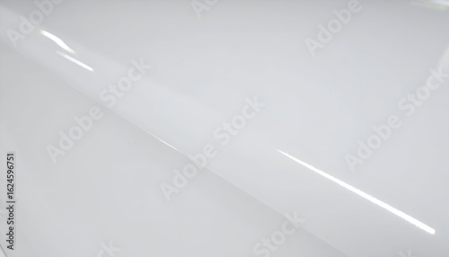 Luminous Reflection on a Sleek, Curved, High-Gloss White Surface