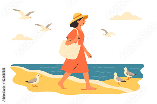 A woman wearing a hat strolls along the beach accompanied by seagulls and crashing ocean waves