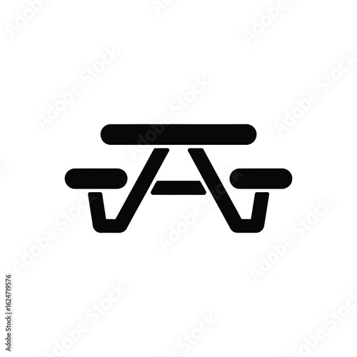 Simple black icon of a picnic table with attached benches