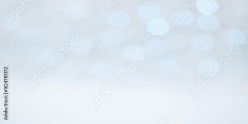 Blue Christmas bokeh light background with bright glowing silver snowflake pattern and shiny winter holiday decoration