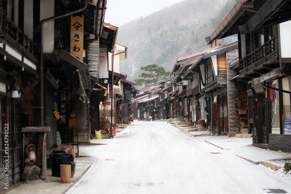 Fototapeta premium Snowy street in the rural and traditional town of narai in japan