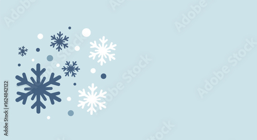 Winter snowflakes falling on light blue background for seasonal greetings