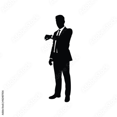 Silhouette of a businessman checking his watch
