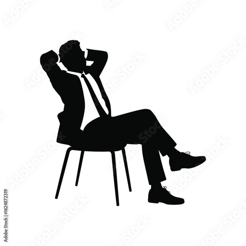 Silhouette of a businessman relaxing in a chair with hands behind his head