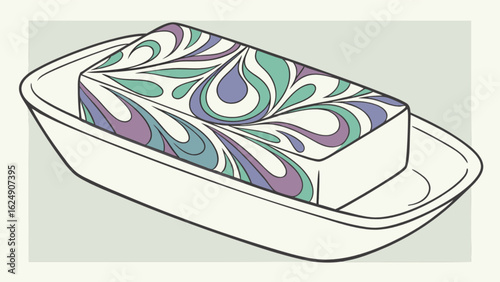 Handcrafted soap bar with swirl design on soap dish for bathroom decor and personal hygiene product display