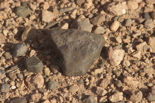 Wallpaper Mural A close up of a black stone on the ground Torontodigital.ca