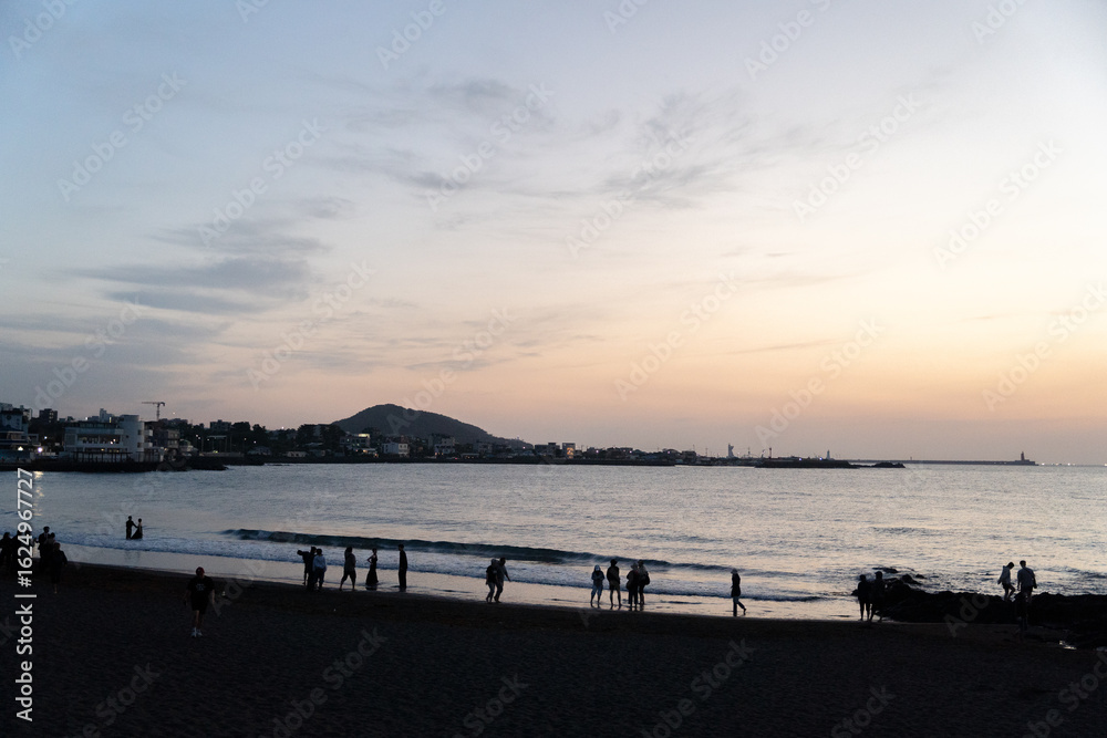 Fototapeta premium The sunset view of the beautiful beach on Jeju Island
