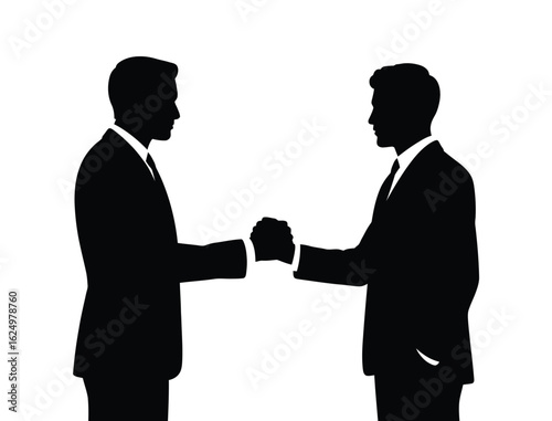 Silhouette of two businessmen shaking hands against a white background