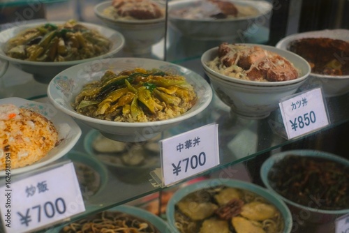 Food samples (called shokuhin sampuru in Japanese) — also known as food replicas or fake food — are hyper-realistic plastic models of dishes displayed in restaurant windows. Made from plastic or resin