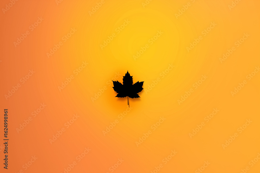 Fototapeta premium Black Maple Leaf Silhouette Centered on Warm Orange‑Amber Autumn Gradient