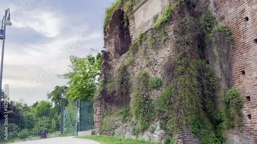 Milan, Italy - May 4 2025 : Exterior architectural details and surrounding moat of Sforza Castle (Castello Sforzesco), the historic fortress in the heart of Parco Sempione