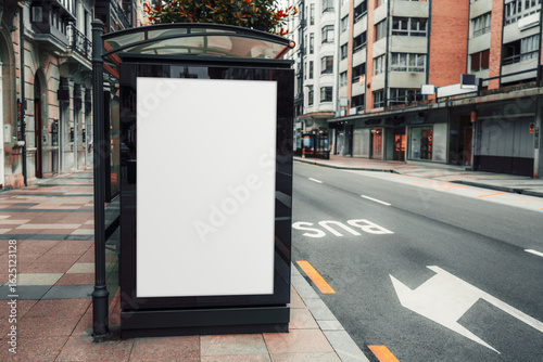 Blank vertical advertising mockup on a modern glass bus stop shelter in an urban street setting, with 