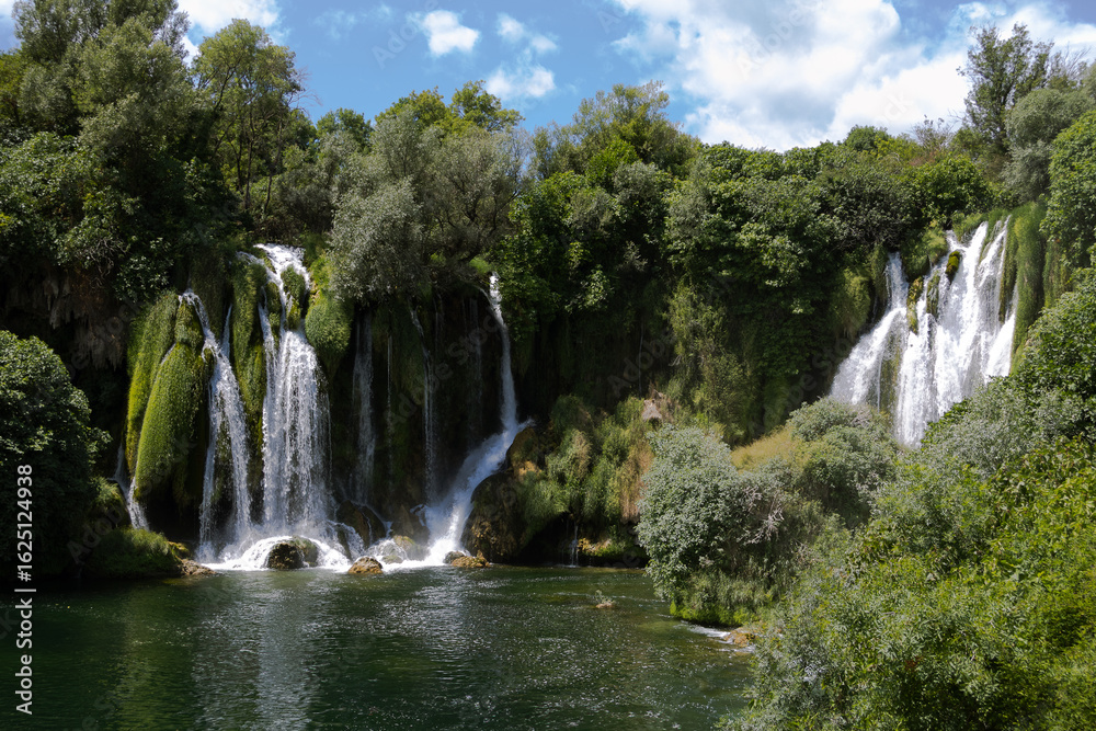 Fototapeta premium cinematic shot of waterfall kravice