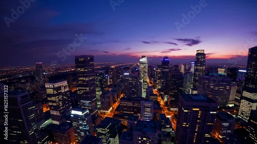 Wallpaper Mural Nighttime Skyline View of Urban Cityscape with Illuminated Buildings and Dramatic Cloudy Sky Torontodigital.ca