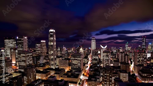 Wallpaper Mural Aerial View of Urban City Skyline at Twilight with Dramatic Clouds and Illuminated Skyscrapers Torontodigital.ca