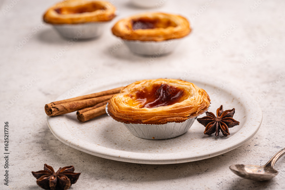 Fototapeta premium Traditional Portuguese custard tarts or Pastel de Nata freshly baked cream dessert. High quality photo