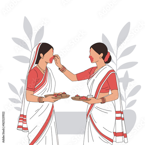 Two women wearing traditional indian sarees applying red powder to each others cheeks during a festival celebration