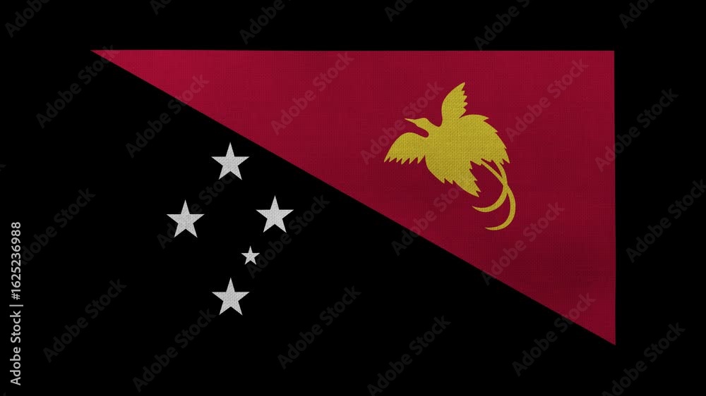 A Papua New Guinea flag rolls and waves in front of a black background.