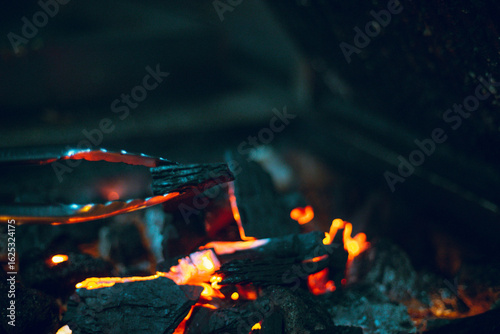 Close-up detail of a piece of coal burning red-hot.