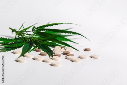 medical cannabis on a light, white background with natural pills