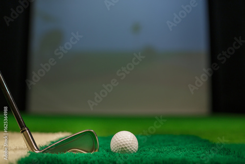 Golf Ball and Iron Club on Artificial Turf in Indoor Golf Simulator for Training or Practice