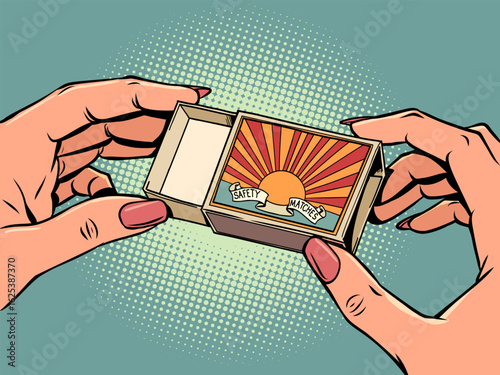 Women's hands holding a matchbox. Items for a hike, tourist explorer. Hot sale and discounts.