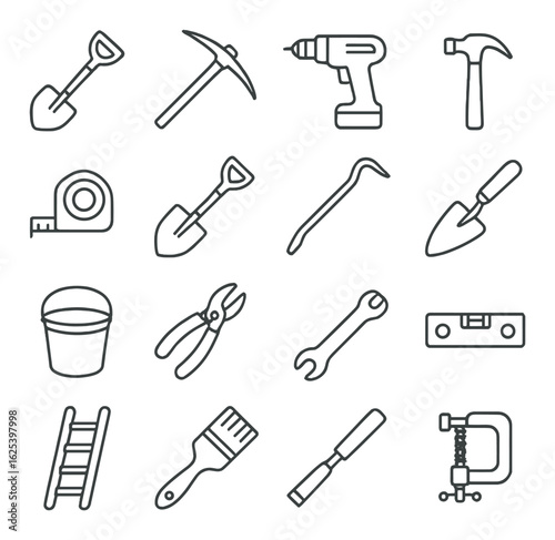 Assorted hand tools on gray background: shovel, pickaxe, drill, hammer, and more