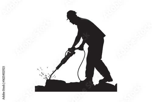 Silhouette of a construction worker wearing a hard hat and safety vest operating a jackhammer to break up concrete or pavement on a construction site