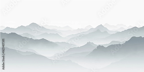 Misty mountain landscape with foggy peaks and clouds at sunrise
