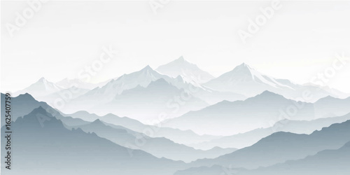 Misty morning light illuminates snow-capped mountain peaks and a serene landscape