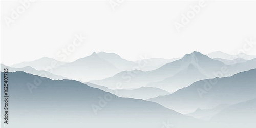 Winter sunrise over misty mountain peaks