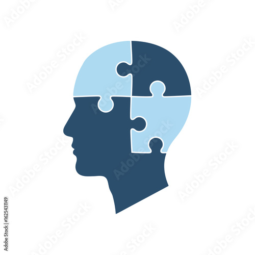Silhouette of a human head composed of puzzle pieces.
