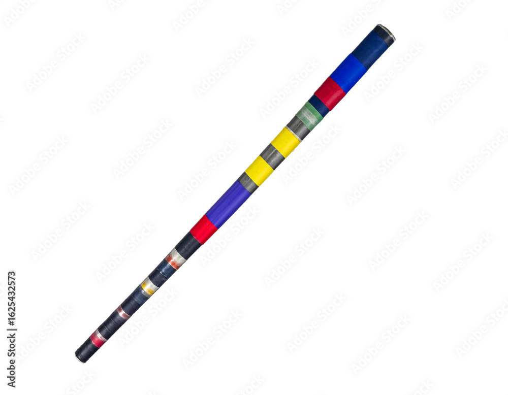 Fototapeta premium Vibrant striped ceremonial staff crafted with colorful tape, symbolizing tradition and cultural heritage.