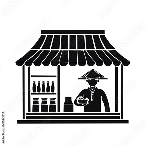 Asian street vendor in traditional conical hat selling food from a market stall with bottles and jars
