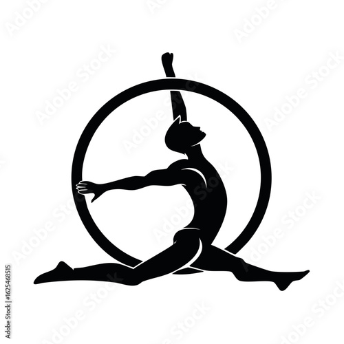 Silhouette of a male aerialist performing a split on a lyra aerial hoop