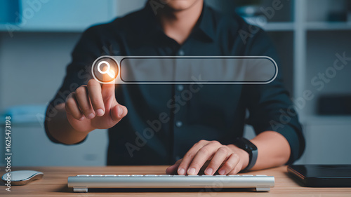 Digital Search: A person interacts with a digital search bar, symbolizing the pursuit of knowledge, information, and the power of the internet in a modern, technology-driven world.