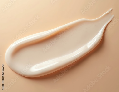 Cosmetic texture gel smear on beige background. Swirl of pale pink cream product with glossy smooth finish. Ideal for beauty product advertising, makeup skincare content, showing product quality,