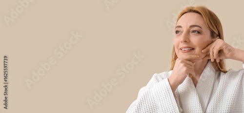 Happy mature woman in bathr...