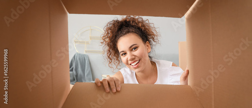 Happy woman with open box, ...
